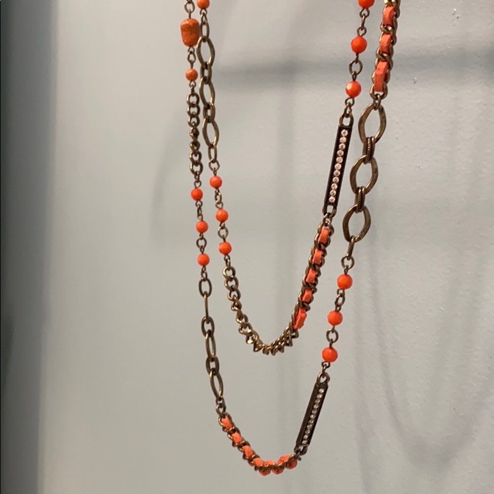 Extra long coral colored necklace